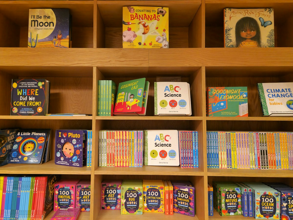 A bookshelf stocked with colorful children's books